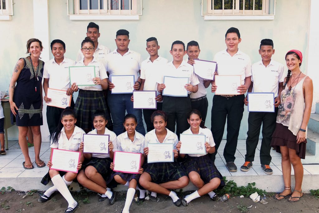 students pose with certificates